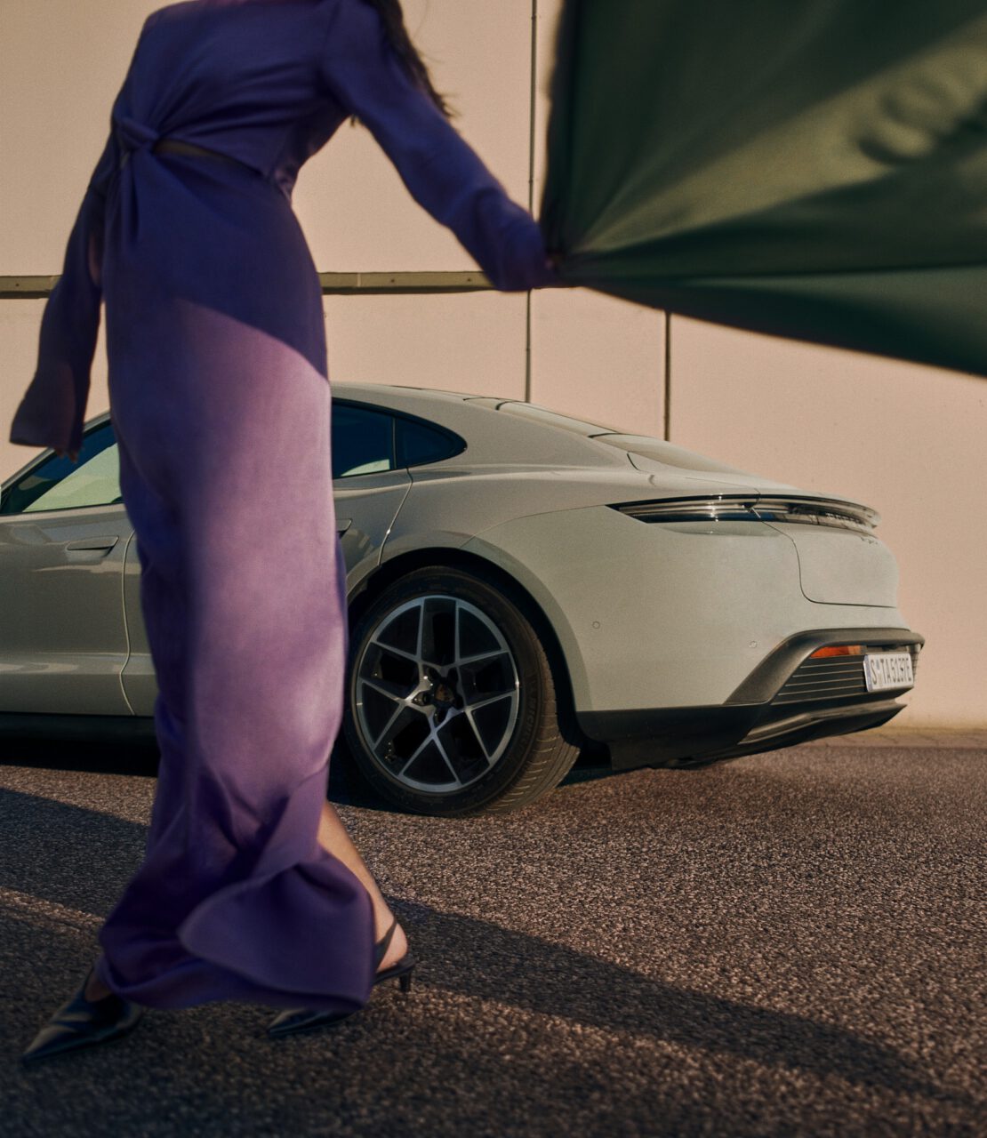 Porsche campaign featuring sleek automotive photography by Paula Nietner and modern styling by Alexandra Heckel. A dynamic showcase of luxury car design and contemporary fashion.